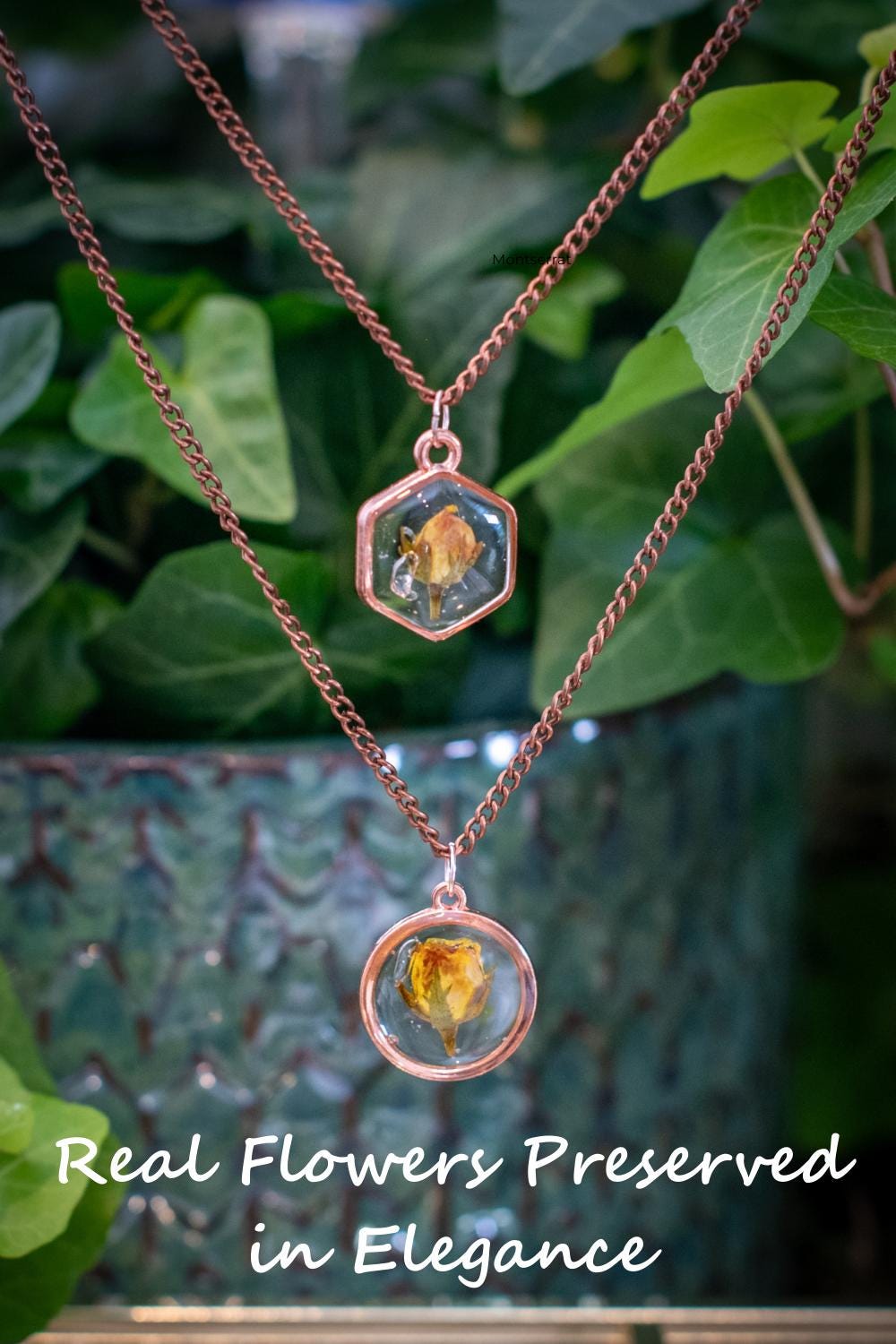 Real rose jewelry photographed on a wood background with soft lighting. This handmade piece features a preserved pink rose in clear resin, hung on an adjustable chain โ a nature-inspired treasure made to celebrate love, growth, and beauty.