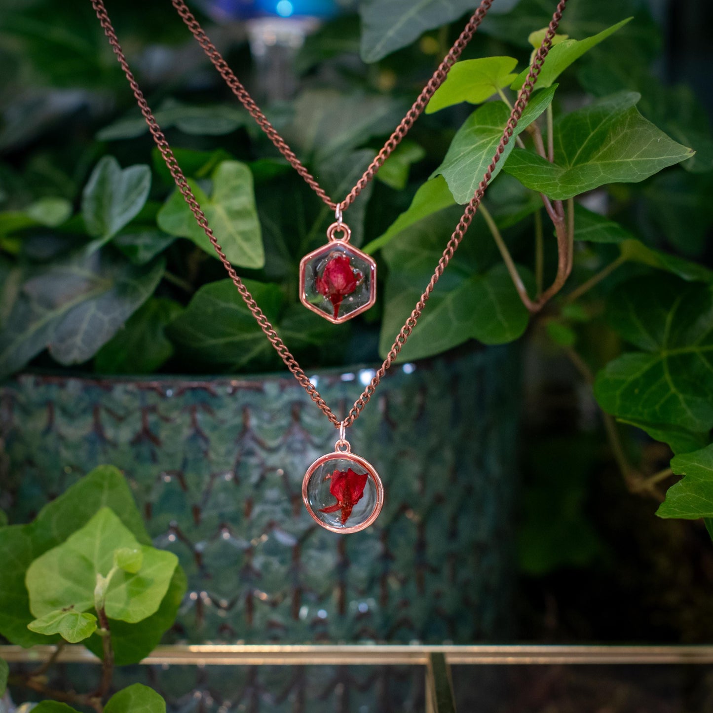 Botanical jewelry featuring a real rose in clear resin, styled for a womanβs birthday gift. Dainty and elegant with a personalized touch.