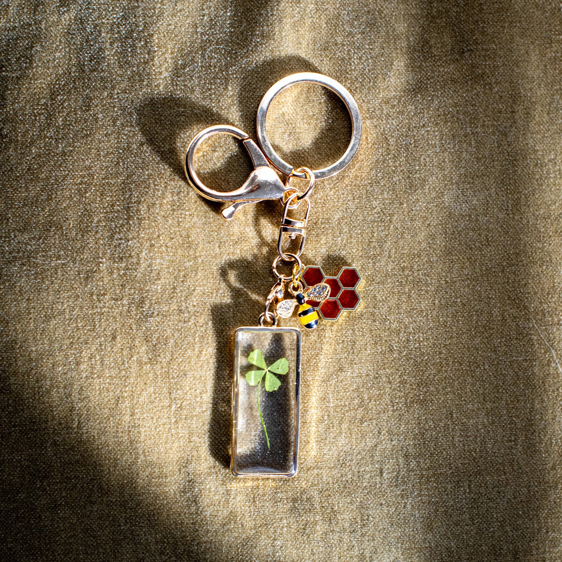 Nature Lovers Gift Gold Bee Keychain Featuring Four Leaf Clover Charm Honeycomb Detail Perfect For Irish Heritage Theme Lucky Charm Set Of Five Charms Unique Bee Design Handmade Accessory Beekeeper Gift Special Occasion Present