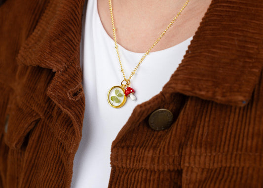 Real four leaf clover necklace in gold resin pendant lucky charm jewelry botanical bridal shower gift Wildly In Love theme nature inspired wedding favor cottagecore aesthetic St Patricks Day gift handmade good luck necklace whimsical keepsake