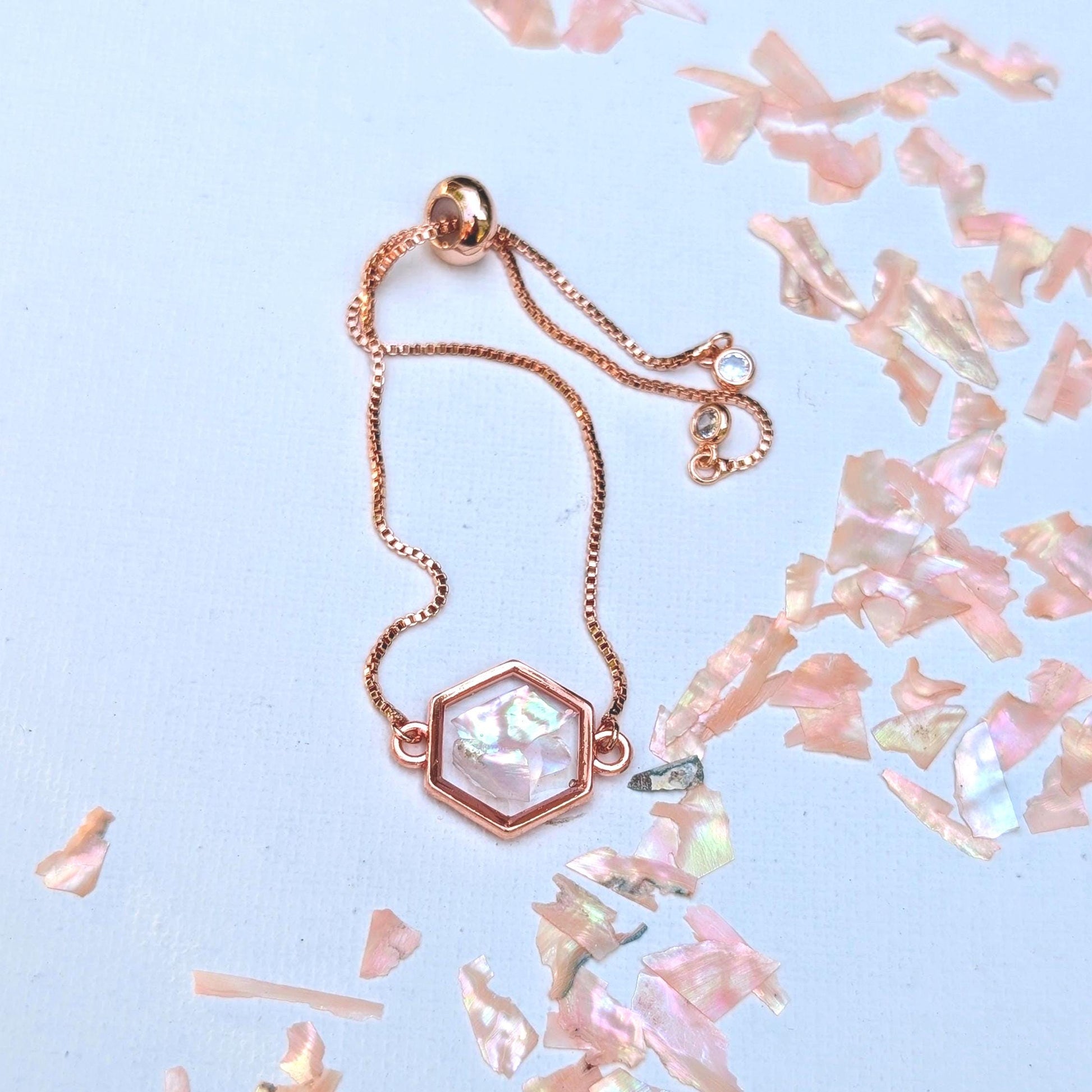 Teen girl gift idea featuring pastel pink charm bracelet