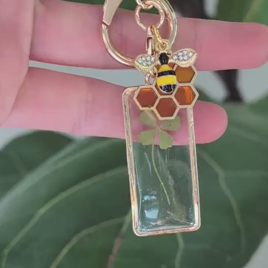 whimsical gold bee keychain real pressed flowers four leaf clover charm handmade gift for bee lovers witches positivity and new beginnings
