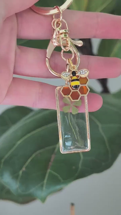 whimsical gold bee keychain real pressed flowers four leaf clover charm handmade gift for bee lovers witches positivity and new beginnings